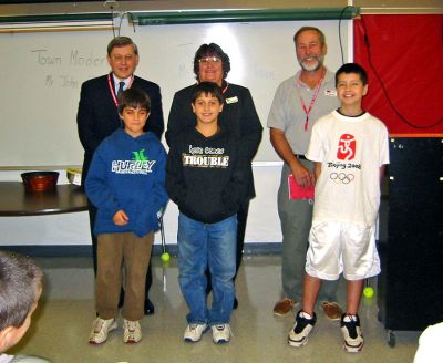 Civics Class
The Enrichment Program at Old Hammondtown School in Mattapoisett recently sponsored a visit from several Mattapoisett town officials to Grade 5 students to discuss local government and the officials roles in Mattapoisett. Pictured here are (back row, l. to r.) Mattapoisett Town Moderator Jack Eklund; Town Clerk Barbara Sullivan; and Selectman Ray Andrews with Grade 5 students (front row, l. to r.) Casey Mackenzie; Collin Anderson; and Andrew Maestas. (Photo courtesy of Cathleen Sinnott).
