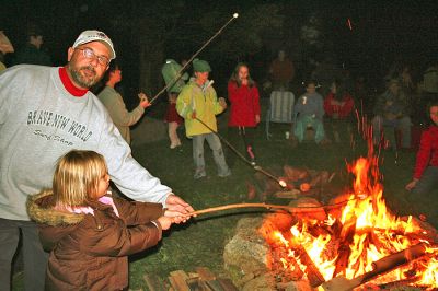 Cozy Campfire
The Mattapoisett Land Trust sponsored a bonfire at the Dunseith Gardens Seahorse property on Saturday, October 18, which included toasting marshmallows and entertainment provided by Luana Josvold. (Photo by Robert Chiarito).
