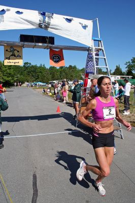 Marion Village 5K
JoAnn Mathews of South Dartmouth crosses the finish line in the tenth annual Marion Village 5K Road Race, finishing 11th overall and taking first place honors in the female division with a final time of 18:40. (Photo by Robert Chiarito).
