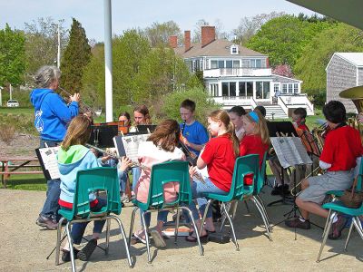 Marion Spruces Up
Marion celebrated Arbor Day on Saturday, May 12 by urging people to come out and volunteer their time for a town wide clean-up effort. Here members of the Sippican School Band perform at Island Wharf during the event. (Photo by Robert Chiarito).

