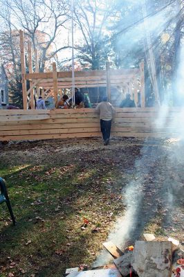 Barn Building
Neighbors and friends of Dan and Kellie Crete have been working together the last few months to raise an old-fashioned, handmade barn on the couples property at 69 Holmes Street in Marion. Dan Crete and his family sought to add this one-of-a-kind addition to their home to be used as a gathering place for his friends and family using no nails, handmade pegs, a lot of manpower and a little bit of Yankee ingenuity. (Photo by Robert Chiarito).
