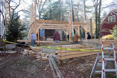 Barn Building
Neighbors and friends of Dan and Kellie Crete have been working together the last few months to raise an old-fashioned, handmade barn on the couples property at 69 Holmes Street in Marion. Dan Crete and his family sought to add this one-of-a-kind addition to their home to be used as a gathering place for his friends and family using no nails, handmade pegs, a lot of manpower and a little bit of Yankee ingenuity. (Photo by Robert Chiarito).
