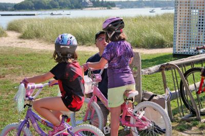 Bike Safety Day
The Marion Police Department sponsored a Bicycle Safety Day for children and young adults at Silvershell Beach on Saturday morning, August 2. The day included bicycle safety information, a rodeo course and certificate awards for all participants. In addition, the Marion Police Department was awarded a statewide grant by the Massachusetts Executive Office of Public Safety and Security to provide 75 bicycle helmets during the event. (Photo by Robert Chiarito).
