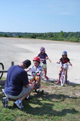 Bike Safety Day
The Marion Police Department sponsored a Bicycle Safety Day for children and young adults at Silvershell Beach on Saturday morning, August 2. The day included bicycle safety information, a rodeo course and certificate awards for all participants. In addition, the Marion Police Department was awarded a statewide grant by the Massachusetts Executive Office of Public Safety and Security to provide 75 bicycle helmets during the event. (Photo by Robert Chiarito).
