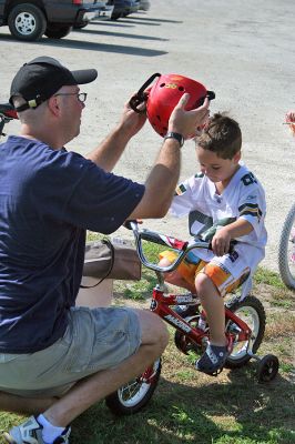 Bike Safety Day
The Marion Police Department sponsored a Bicycle Safety Day for children and young adults at Silvershell Beach on Saturday morning, August 2. The day included bicycle safety information, a rodeo course and certificate awards for all participants. In addition, the Marion Police Department was awarded a statewide grant by the Massachusetts Executive Office of Public Safety and Security to provide 75 bicycle helmets during the event. (Photo by Robert Chiarito).
