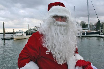 Here Comes Santa Claus
Jolly Saint Nick arrives via "water sleigh" in Sippican Harbor to pay an early Christmas visit to Marion residents during the annual Village Stroll held on Sunday, December 14. (Photo by Robert Chiarito).
