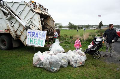 Marion Cleanup
The Marion Tree Committee, the Sippican Lands Trust, the Sippican Historical and Preservation Society, the Marion Garden Discussion Group, the Marion Natural History Museum and the Town of Marion Department of Public Works (DPW) sponsored an "Arbor Day - Spring Clean Up" on Saturday, May 10 with residents pitching in to help dispose of all their winter trash. (Photo by Robert Chiarito).
