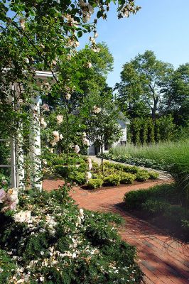 Gorgeous Gardens
One of the many beautiful homes that will be included in the annual Gardens by the Sea, a tour of private, Marion gardens sponsored by Saint Gabriels Episcopal Church, which will take place on Friday, July 11 from 10:30 am to 4:30 pm. The event will include a luncheon at a private seaside club and a Bake/Plant Sale. Tour Only tickets are $20 each and may be purchased at the Marion General Store and Saint Gabriels Church in Marion. (Photo by and courtesy of Laura McLean.)
