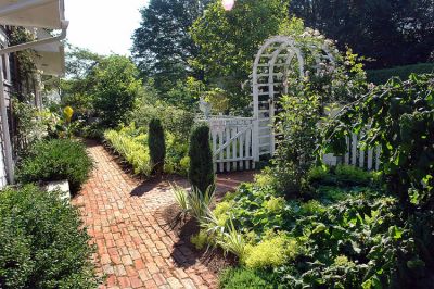 Gorgeous Gardens
One of the many beautiful homes that will be included in the annual Gardens by the Sea, a tour of private, Marion gardens sponsored by Saint Gabriels Episcopal Church, which will take place on Friday, July 11 from 10:30 am to 4:30 pm. The event will include a luncheon at a private seaside club and a Bake/Plant Sale. Tour Only tickets are $20 each and may be purchased at the Marion General Store and Saint Gabriels Church in Marion. (Photo by and courtesy of Laura McLean.)
