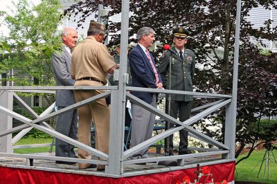 Memorial Day 2007
Board of Selectmen Chairman Andrew Jeffrey addresses the crowd while fellow Selectmen Jonathan Henry (right, in uniform) and Roger Blanchette (far left) look on during the town's Annual Memorial Day Exercises held outside of the Marion Town House on Monday morning, May 28. (Photo by Robert Chiarito).
