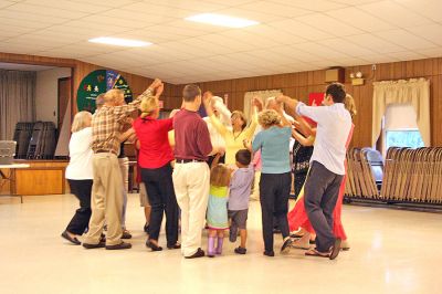 Do-Si-Do in Marion
On Sunday, September 14, the first of what is hoped to be an annual series of Marion Square Dances was held inside the Marion Community Center. Although initially slated to take place in the parking lot adjacent to the Marion General Store, the weekends rainy weather forced the event indoors. Caller Jim Schell of Lakeville had veteran square dancers and novices alike promenading, allemanding, bowing to their partners and do-si-doing with ease. (Photo by Robert Chiarito).
