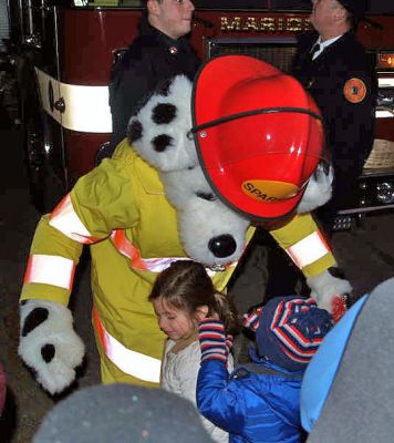 Seeing Sparky
Sparky the Fire Dog was on hand for the 2006 Marion Village Holiday Stroll to help remind everyone to be safe during this Christmas season of lights. (Photo by Robert Chiarito).
