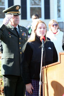 Marion Veterans Day 2008
ORR Student Chelsie Nectow sings "The Star Spangled Banner" during the recent Veterans' Day Celebration in Marion, while Selectman Jonathan Henry stands at attention behind her. (Photo by Robert Chiarito).
