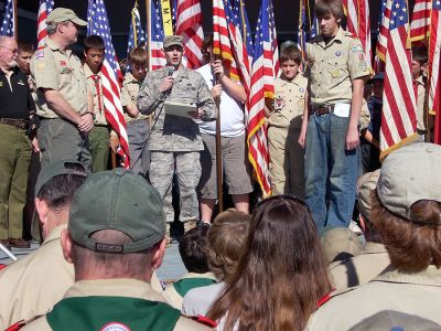 Scouts Honored
Technical Sergeant Christopher Qubeck from the Air National Guard, Otis AFB recently presented Boy Scout Troop 53 of Mattapoisett with a flag flown on a combat mission over Iraq, along with a commendation from the US Air Force for their work in sending care packages to soldiers overseas during the past couple of years. Technical Sergeant Qubeck presented the flag and certificate to Mattapoisett Scoutmaster Ron Ellis and Senior Patrol Leader Bryan Buckley at the opening ceremony for MassJam 2008.
