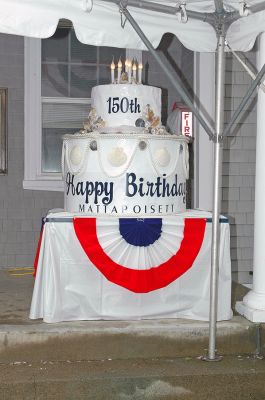 Mattapoisett Birthday Bash
A display cake was lit as party-goers enjoyed one of 150 cupcakes during Mattapoisett's 150th Birthday Celebration held on Sunday, May 20, 2007 outside Town Hall. (Photo by Tim Smith).
