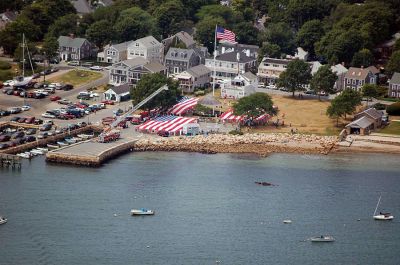 Glory Unfurled
Mattapoisett's weeklong 150th Sesquicentennial Celebration was capped off with a closing ceremony featuring the glorious unfurling of three large versions of the Stars and Stripes, courtesy of the National Flag Truck exhibit, in the area of the Town Wharf and Shipyard Park on Sunday afternoon, August 12. (Photo by Ken Howland).
