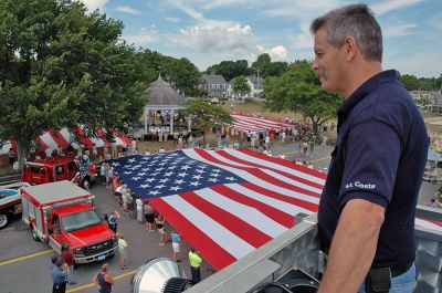 Glory Unfurled
Mattapoisett's weeklong 150th Sesquicentennial Celebration was capped off with a closing ceremony featuring the glorious unfurling of three large versions of the Stars and Stripes, courtesy of the National Flag Truck exhibit, in the area of the Town Wharf and Shipyard Park on Sunday afternoon, August 12. (Photo by Tim Smith).
