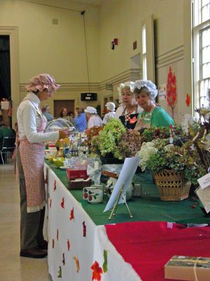 Making Mattapoisett Merry
Volunteers dressed in period clothing at the Mattapoisett Congregational Church's annual "Village Country Store" holiday fair held on Saturday, November 11. (Photo by Robert Chiarito).
