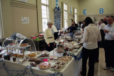 Christmas Fair
Alice Mendell tempts shoppers with a variety of baked goods during the Mattapoisett Congregational Church's Annual Holiday Fair held on Saturday, November 15 inside the church's Reynard Hall. (Photo by Robert Chiarito).
