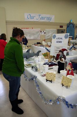 Christmas Fair
A shopper looks over some of the handmade items during the Mattapoisett Congregational Church's Annual Holiday Fair held on Saturday, November 15 inside the church's Reynard Hall. (Photo by Robert Chiarito).
