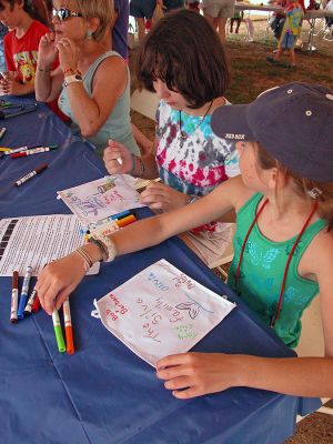 Celebrating Diversity
Children create tiles for a large quilt to be displayed at the elementary schools during Mattapoisett's Cultural Diversity Day held in Shipyard Park on Tuesday, August 7 as part of the town's weeklong slate of sesquicentennial events. (Photo by Kenneth J. Souza).
