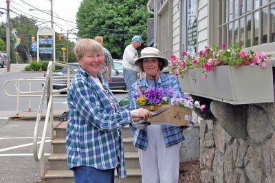 Postal Plantings
Anne Shepley and Pat McCarthy of the Garden Group of the Mattapoisett Womans Club recently spent the morning adding colorful plantings to the window boxes outside the Mattapoisett Post Office. The group takes on this project every year and maintains the plantings throughout the summer months. (Photo by Robert Chiarito).
