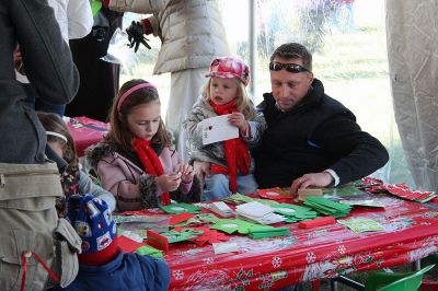 Holiday in the Park
One of the big draws during Mattapoisett's Annual Holiday in the Park held on Saturday, December 6, 2008 in Shipyard Park was a crafts tent where kids and family members were able to make their own Christmas ornaments and decorations for the town tree. (Photo by Robert Chiarito).
