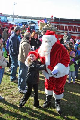 Holiday in the Park 2007
Here Santa arrives for Mattapoisett's annual "Holiday in the Park" celebration which was held in Shipyard Park on Saturday, December 1, 2007 and drew a record crowd to the seasonal seaside event. (Photo by Robert Chiarito).
