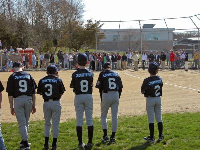 Mattapoisett Opening Day 2007
Opening Day Ceremonies for the 2007 season of Mattapoisett Youth Baseball (MYB) included special guests and local legends such as former American Idol contestant Ayla Brown, who sang the National Anthem and threw out the ceremonial first pitch, and former Boston Red Sox pitcher Brian Rose. The day also included a tribute to longtime MYB supporter and former Mattapoisett Recreation Director John Haley with the field at Old Hammondtown School in his honor. (Photo by Robert Chiarito).
