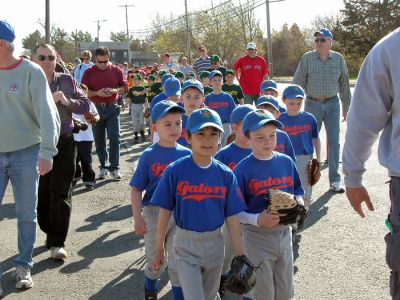 Mattapoisett Opening Day 2007
Opening Day Ceremonies for the 2007 season of Mattapoisett Youth Baseball (MYB) included special guests and local legends such as former American Idol contestant Ayla Brown, who sang the National Anthem and threw out the ceremonial first pitch, and former Boston Red Sox pitcher Brian Rose. The day also included a tribute to longtime MYB supporter and former Mattapoisett Recreation Director John Haley with the field at Old Hammondtown School in his honor. (Photo by Robert Chiarito).
