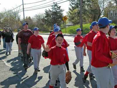 Mattapoisett Opening Day 2007
Opening Day Ceremonies for the 2007 season of Mattapoisett Youth Baseball (MYB) included special guests and local legends such as former American Idol contestant Ayla Brown, who sang the National Anthem and threw out the ceremonial first pitch, and former Boston Red Sox pitcher Brian Rose. The day also included a tribute to longtime MYB supporter and former Mattapoisett Recreation Director John Haley with the field at Old Hammondtown School in his honor. (Photo by Robert Chiarito).
