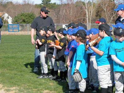 Mattapoisett Opening Day 2007
Opening Day Ceremonies for the 2007 season of Mattapoisett Youth Baseball (MYB) included special guests and local legends such as former American Idol contestant Ayla Brown, who sang the National Anthem and threw out the ceremonial first pitch, and former Boston Red Sox pitcher Brian Rose. The day also included a tribute to longtime MYB supporter and former Mattapoisett Recreation Director John Haley with the field at Old Hammondtown School in his honor. (Photo by Robert Chiarito).
