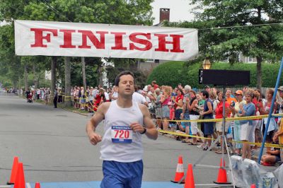 Mattapoisett Road Race 2008
Denis Newman of Philadelphia, PA crosses the finish line in 27:45 to place first overall in the 2008 Mattapoisett Road Race held on July 4. (Photo by Kenneth J. Souza).
