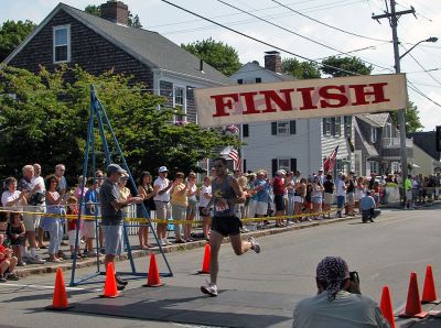 Winner by George
George Luke of Clinton, CT was the first to cross the finish line in the 37th annual Mattapoisett July 4 Road Race, completing the five-mile trek in just 26:23 with a pace of 5:17. (Photo by Kenneth J. Souza).
