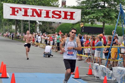 Mattapoisett Road Race 2008
John Bucci of Chapel Hill, NC, crosses the finish line in 30:41 to place 10th overall in the Mattapoisett Road Race held on July 4, 2008. (Photo by Kenneth J. Souza).
