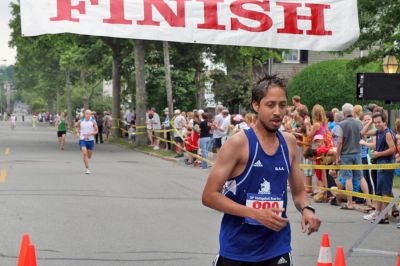 Mattapoisett Road Race 2008
Deon Barrett of Canton, MA crosses the finish line in 28:17 to place second overall in the Mattapoisett Road Race held on July 4, 2008. (Photo by Kenneth J. Souza).
