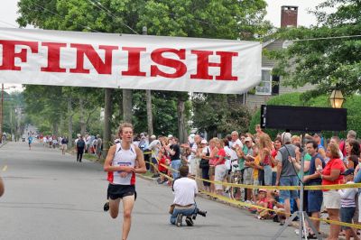 Mattapoisett Road Race 2008
Max Darrah of Mashpee crosses the finish line in 29:01 to place fifth overall in the Mattapoisett Road Race held on July 4, 2008. (Photo by Kenneth J. Souza).
