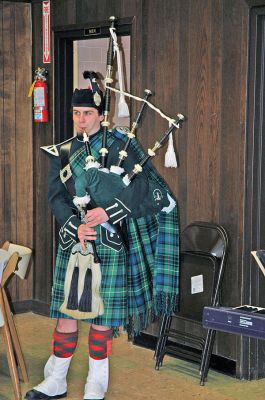 Potluck o' the Irish
Saint Anthony's Church in Mattapoisett held a friendly celebration in honor of Saint Patrick's Day with a potluck dinner and sing-along. Visitors were also welcomed into the churchs fellowship hall by the sounds of Brendan Begleys bagpipes, the singing of traditional Irish songs, and a performance Celtic dancing. (Photo by Robert Chiarito).
