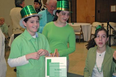 Potluck o' the Irish
Saint Anthony's Church in Mattapoisett held a friendly celebration in honor of Saint Patrick's Day with a potluck dinner and sing-along. Visitors were also welcomed into the churchs fellowship hall by the sounds of Brendan Begleys bagpipes, the singing of traditional Irish songs, and a performance Celtic dancing. (Photo by Robert Chiarito).
