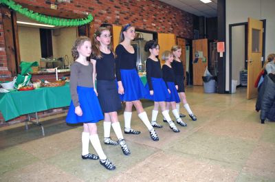 Potluck o' the Irish
Saint Anthony's Church in Mattapoisett held a friendly celebration in honor of Saint Patrick's Day with a potluck dinner and sing-along. Visitors were also welcomed into the churchs fellowship hall by the sounds of Brendan Begleys bagpipes, the singing of traditional Irish songs, and a performance Celtic dancing. (Photo by Robert Chiarito).
