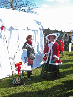 Mattapoisett Holiday Village Stroll 2006
The Town of Mattapoisett celebrated their first annual Holiday Village Stroll on Saturday, December 2 at various venues in and around Shipyard Park. The event included a visit from Santa Claus, Mrs. Claus, and friends, along with the traditional town tree lighting ceremony. (Photo by Robert Chiarito).
