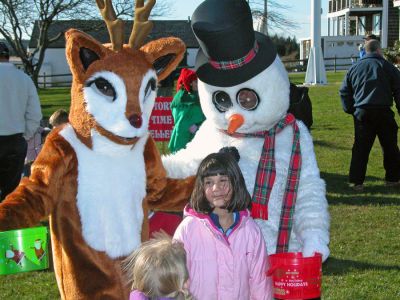 Mattapoisett Holiday Village Stroll 2006
Rudolph the Red-Nosed Reindeer and Frosty the Snowman were two of the guests on hand during Mattapoisett's first annual Holiday Village Stroll on Saturday, December 2 at various venues in and around Shipyard Park. The event included a visit from Santa Claus, Mrs. Claus, and friends, along with the traditional town tree lighting ceremony. (Photo by Robert Chiarito).
