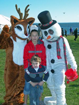Mattapoisett Holiday Village Stroll 2006
Rudolph the Red-Nosed Reindeer and Frosty the Snowman were among the special guests at Mattapoisett's first annual Holiday Village Stroll on Saturday, December 2 in Shipyard Park. The event included a visit from Santa Claus, Mrs. Claus, and friends, along with the traditional town tree lighting ceremony. (Photo by Robert Chiarito).
