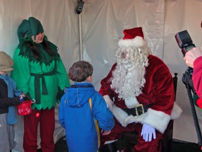 Audience With Saint Nick
Children lined up to tell Santa what they want for Christmas during Mattapoisett's first annual Holiday Village Stroll on Saturday, December 2 at Shipyard Park. (Photo by Chiarito).
