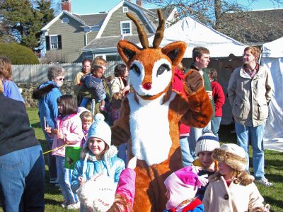 Here's Rudolph!
The Town of Mattapoisett celebrated their first annual Holiday Village Stroll on Saturday, December 2 at various venues in and around Shipyard Park. The event included a visit from Santa Claus, Mrs. Claus, and friends, along with the traditional town tree lighting ceremony. (Photo by Robert Chiarito).
