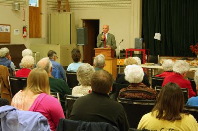 Copter Creator
Dr. David Jenney, a retired mechanical engineer for the Sikorsky Company, recounted his forty years with the company, which included his role as a key member of the team that helped to develop the Black Hawk helicopter, during a recent monthly meeting of the Maconchu Club of Mattapoisett on November 8. A member of the club, Dr. Jenney came to Sikorsky in the early 50s, fresh out of college, looking for a career that would challenge him to use his engineering skills. (Photo by Robert Chiarito).
