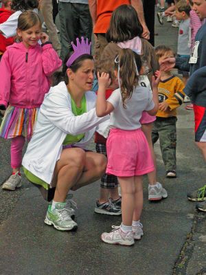 Mom's Marathon '07
An estimated 400 runners and walkers came out to the Oxford Creamery in Mattapoisett on Sunday, May 13 to participate in the first annual Tiara Classic Mothers Day 5K Road Race. The race was held to benefit the Womens Fund of Southeastern Massachusetts. Many of the runners donned tiaras and capes, making this event one of the more colorful local road races. (Photo by Robert Chiarito).
