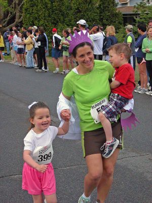 Mom's Marathon '07
An estimated 400 runners and walkers came out to the Oxford Creamery in Mattapoisett on Sunday, May 13 to participate in the first annual Tiara Classic Mothers Day 5K Road Race. The race was held to benefit the Womens Fund of Southeastern Massachusetts. Many of the runners donned tiaras and capes, making this event one of the more colorful local road races. (Photo by Robert Chiarito).
