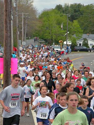 Mom's Marathon '07
An estimated 400 runners and walkers came out to the Oxford Creamery in Mattapoisett on Sunday, May 13 to participate in the first annual Tiara Classic Mothers Day 5K Road Race. The race was held to benefit the Womens Fund of Southeastern Massachusetts. Many of the runners donned tiaras and capes, making this event one of the more colorful local road races. (Photo by Robert Chiarito).
