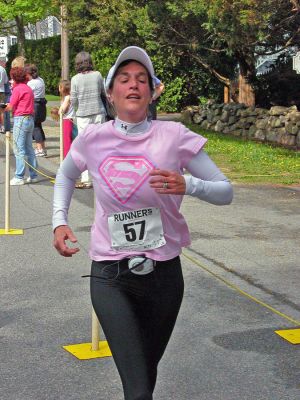 Mom's Marathon '07
An estimated 400 runners and walkers came out to the Oxford Creamery in Mattapoisett on Sunday, May 13 to participate in the first annual Tiara Classic Mothers Day 5K Road Race. The race was held to benefit the Womens Fund of Southeastern Massachusetts. Many of the runners donned tiaras and capes, making this event one of the more colorful local road races. (Photo by Robert Chiarito).
